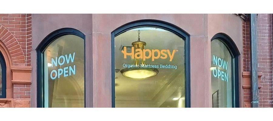 Storefront view of Happsy's mattress store in Boston