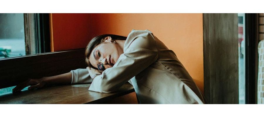 Woman sleeping at desk