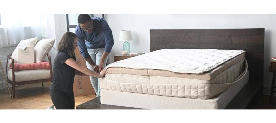 couple assembling naturepedic eos organic mattress