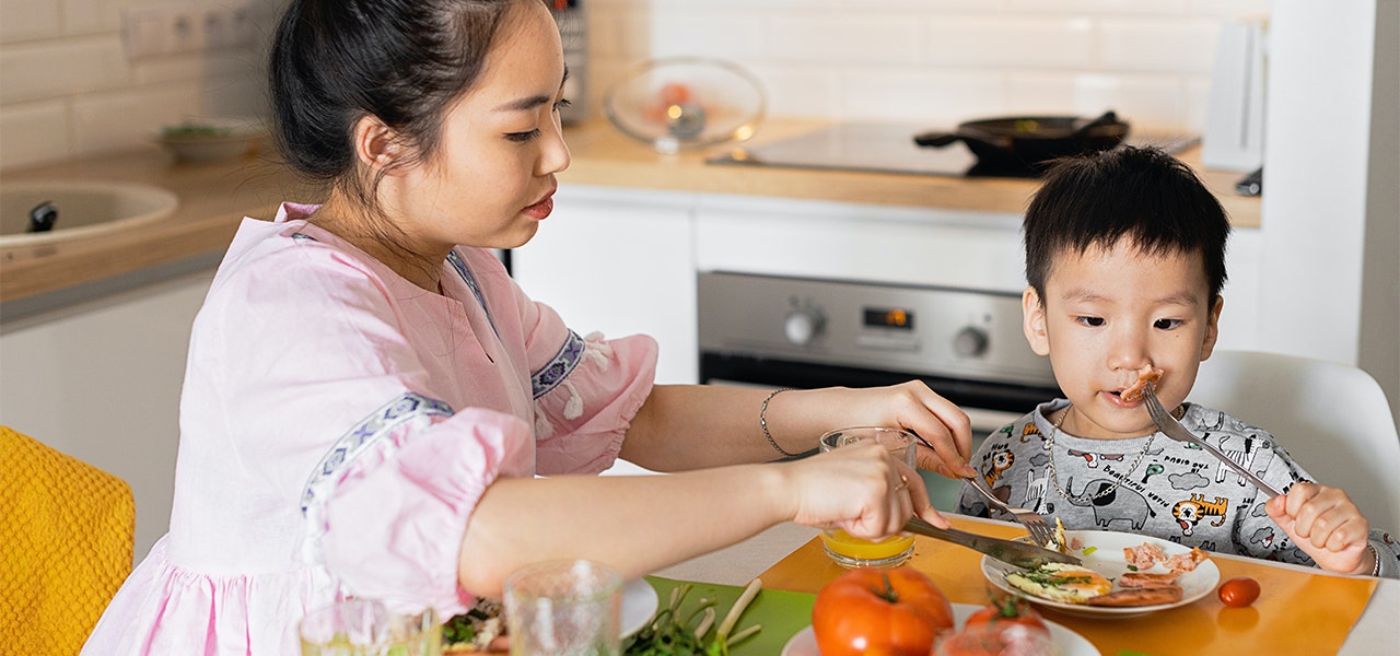 Mother and son eating organic food as cancer prevention