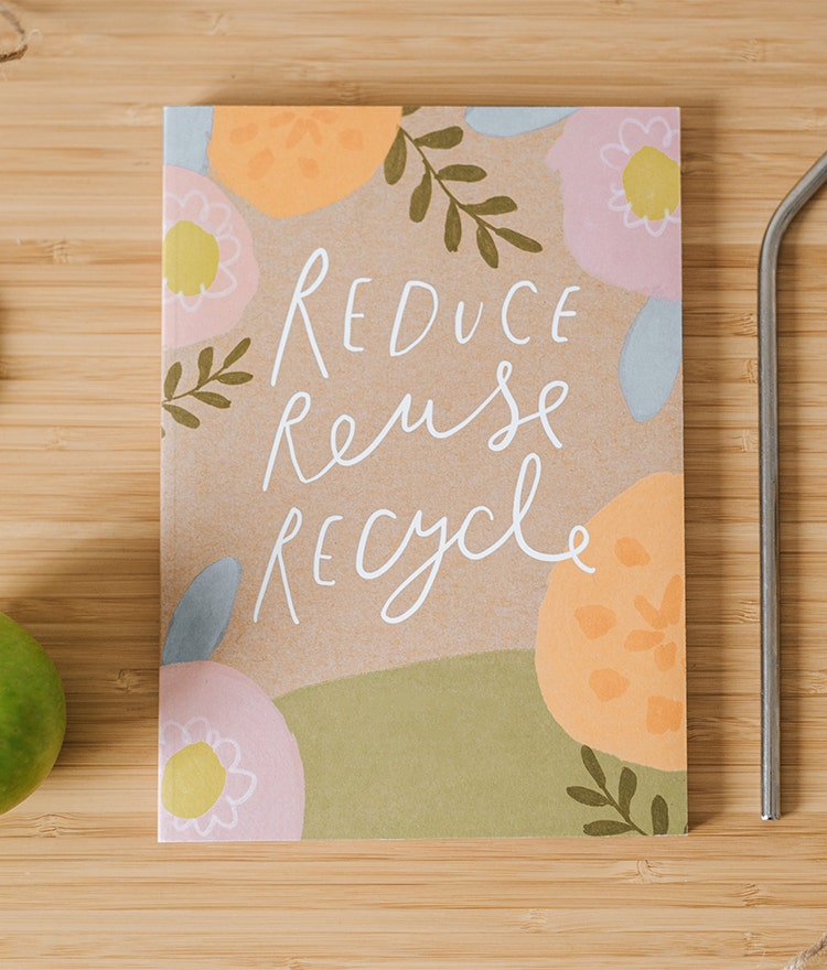 Kraft journal that reads: Reduce, Reuse, Recycle