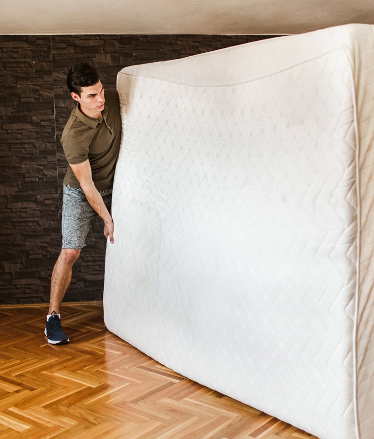 man replacing his mattress with a happsy organic mattress