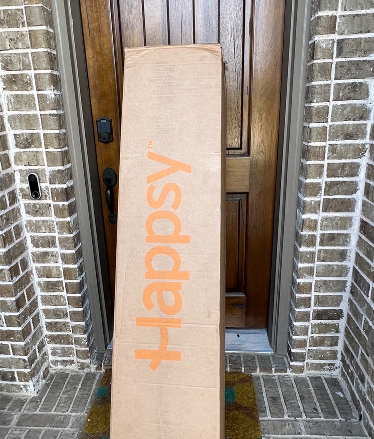 happsy organic bed in a box on doorstep