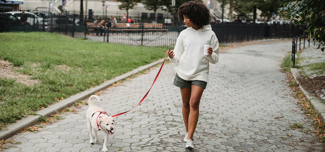 woman walking dog outside