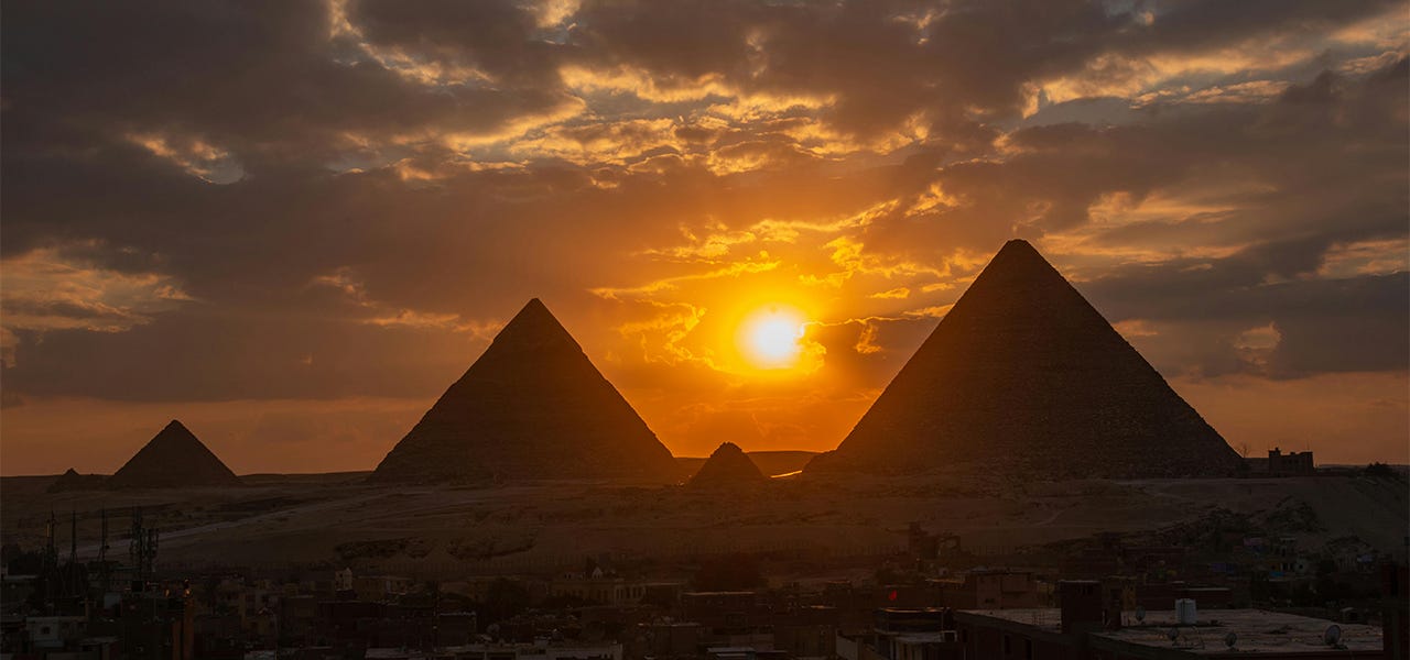 ancient Egyptian pyramids at sunset