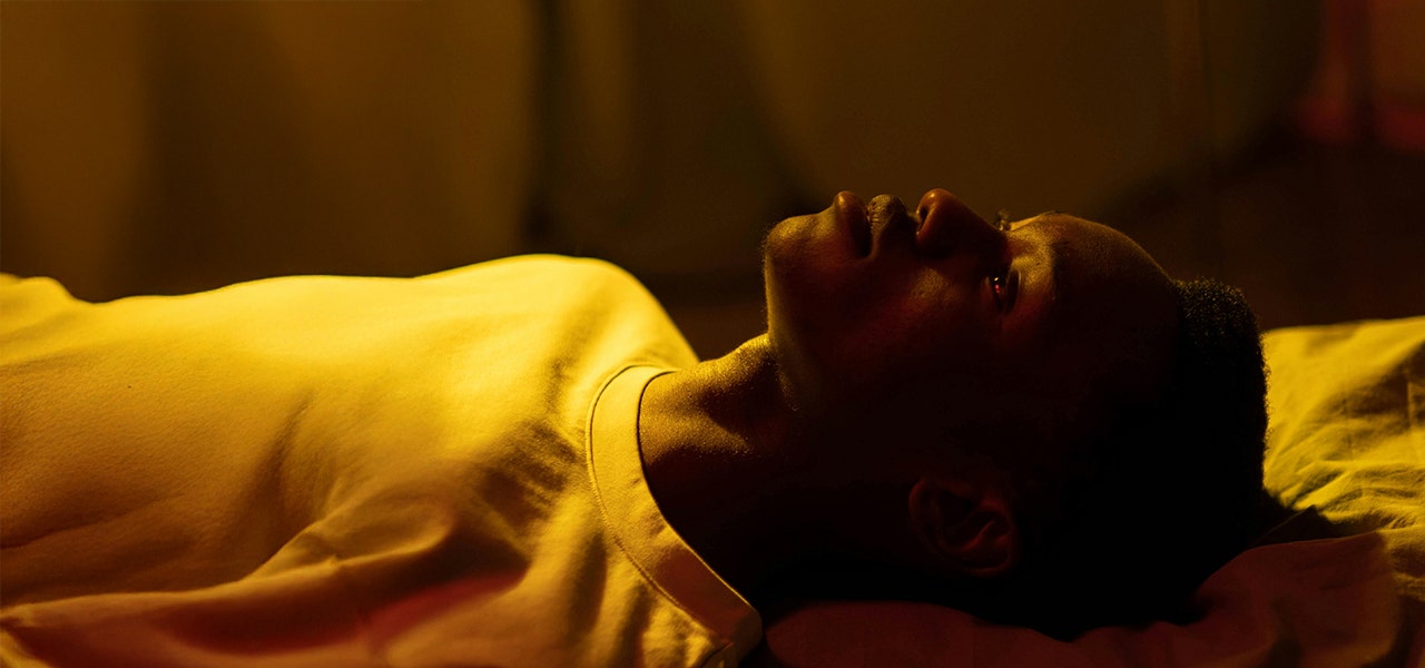 person laying on their back while awake at night