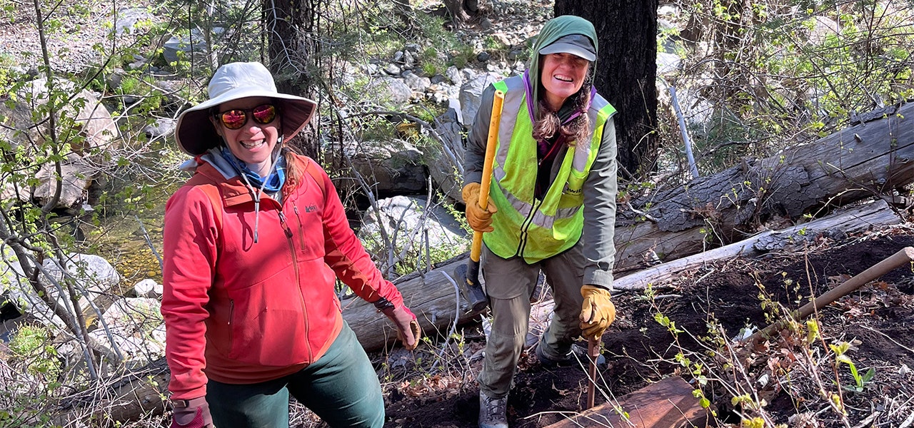 women volunteering in the outdoors with wilderness volunteers