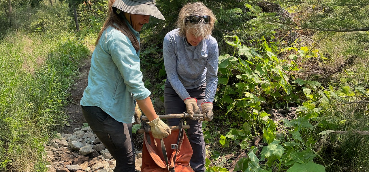 women volunteering in the outdoors with wilderness volunteers