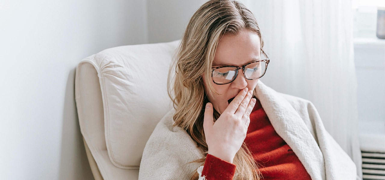 blond adult woman yawning